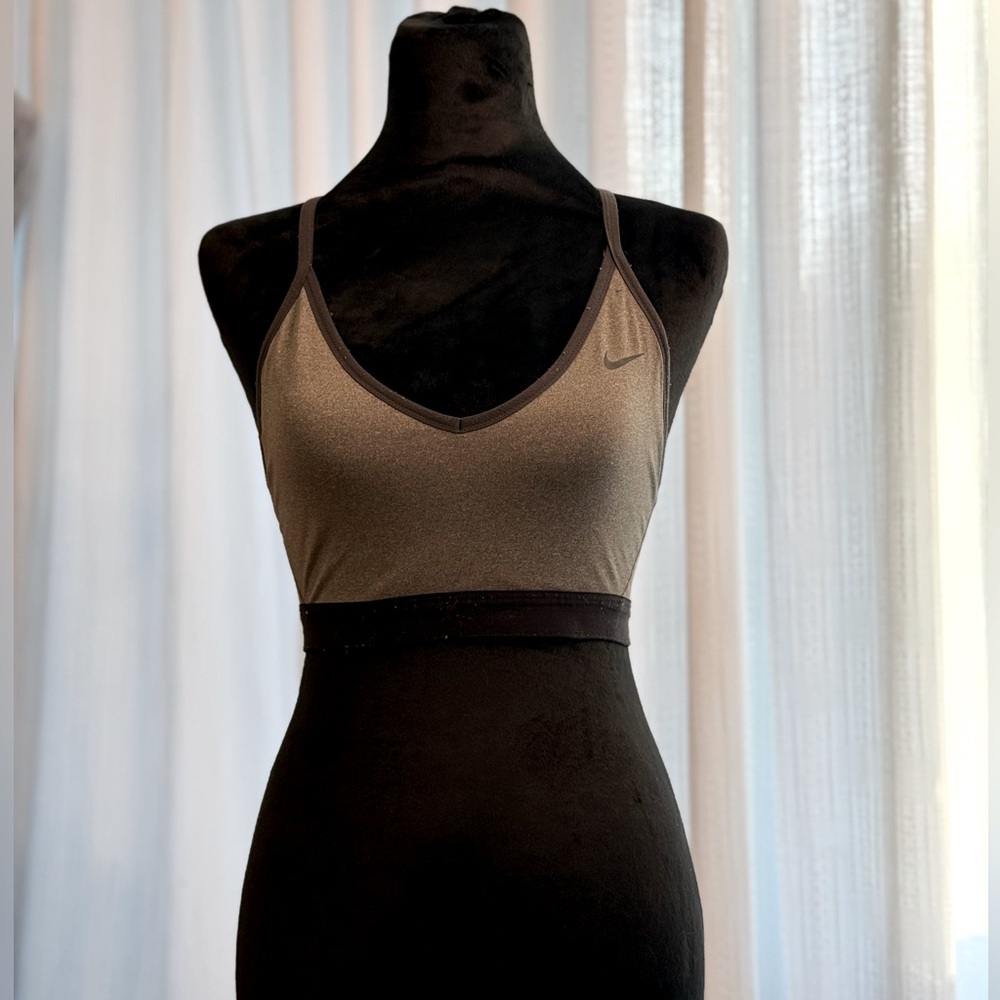 Medium sized Gray with black outlined dry fit sports bra. Heavy support